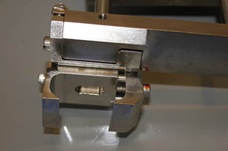 [44909-01/502305] CLAMP ARM MOUNT COATER DISPENCE, USED